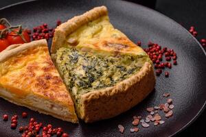 Delicious crispy quiche cut into slices with cheese, broccoli, tomatoes photo