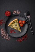 Delicious crispy quiche cut into slices with cheese, broccoli, tomatoes photo