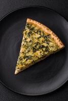 Delicious crispy quiche cut into slices with cheese, broccoli, tomatoes photo