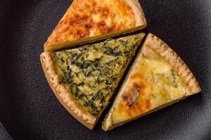 Delicious crispy quiche cut into slices with cheese, broccoli, tomatoes photo