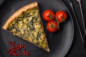 Delicious crispy quiche cut into slices with cheese, broccoli, tomatoes photo