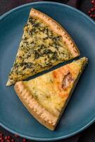 Delicious crispy quiche cut into slices with cheese, broccoli, tomatoes photo