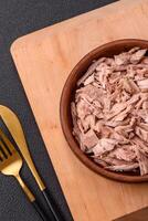 Delicious canned dietary tuna meat with salt, spices and oil photo