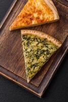 Delicious crispy quiche cut into slices with cheese, broccoli, tomatoes photo