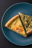 Delicious crispy quiche cut into slices with cheese, broccoli, tomatoes photo