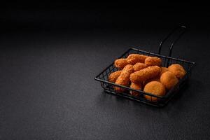 Delicious nuggets, rings and balls of mozzarella and parmesan cheese photo