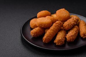 Delicious nuggets, rings and balls of mozzarella and parmesan cheese photo