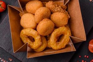 Delicious nuggets, rings and balls of mozzarella and parmesan cheese photo