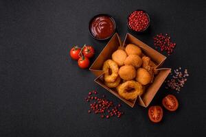 Delicious nuggets, rings and balls of mozzarella and parmesan cheese photo