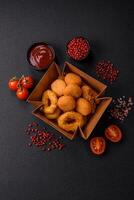 Delicious nuggets, rings and balls of mozzarella and parmesan cheese photo