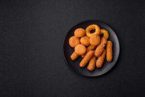 Delicious nuggets, rings and balls of mozzarella and parmesan cheese photo