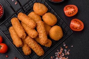 Delicious nuggets, rings and balls of mozzarella and parmesan cheese photo