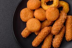 Delicious nuggets, rings and balls of mozzarella and parmesan cheese photo