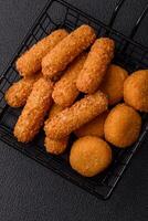 Delicious nuggets, rings and balls of mozzarella and parmesan cheese photo