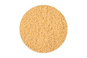 Wheat porridge couscous grains on a dark concrete background photo