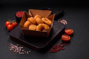 Delicious nuggets, rings and balls of mozzarella and parmesan cheese photo