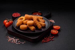 Delicious nuggets, rings and balls of mozzarella and parmesan cheese photo