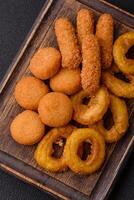 Delicious nuggets, rings and balls of mozzarella and parmesan cheese photo