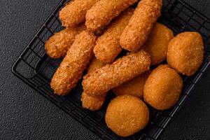 Delicious nuggets, rings and balls of mozzarella and parmesan cheese photo