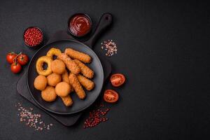 Delicious nuggets, rings and balls of mozzarella and parmesan cheese photo