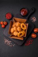 Delicious nuggets, rings and balls of mozzarella and parmesan cheese photo