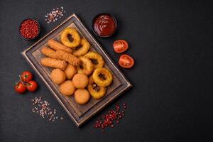 Delicious nuggets, rings and balls of mozzarella and parmesan cheese photo