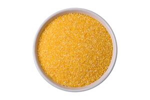 Corn grains or particles are yellow in color when raw photo