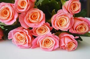 A beautiful bouquet of coral blooming roses. Delicate flowers. photo