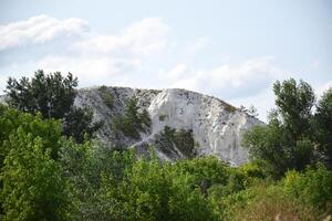 Chalk mountains surrounded by forests and fields in the Kharkiv region. photo