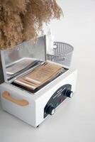 Mini high temperature sterilizer on the white background. photo