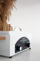 Mini high temperature sterilizer on the white background. photo