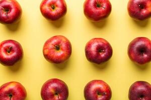 Many red apples on colored background, top view. Autumn pattern with fresh apple above view photo