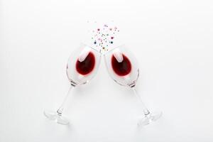 Many glasses of red wine at wine tasting. Concept of red wine on colored background. Top view, flat lay design photo