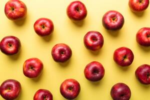 Many red apples on colored background, top view. Autumn pattern with fresh apple above view photo