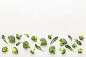 Top view fresh green broccoli vegetable on Colored background. Broccoli cabbage head Healthy or vegetarian food concept. Flat lay. Copy space photo