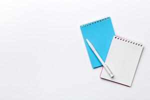 Blank notebook with pen on white background. Back to school and education concept photo