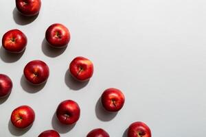 Many red apples on colored background, top view. Autumn pattern with fresh apple above view with copy space for design or text photo