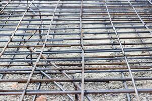 Background of reinforcing steel bars for building armature. Steel reinforcement in the construction of the building photo