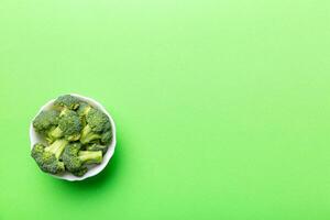 broccoli of fresh green broccoli in bowl over coloredbackground. , close up. Fresh vegetable photo