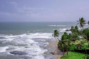 Photographs Taken from Above of Waves Smashing Into the Beach photo