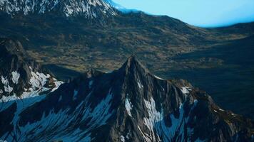 A mountain range with snow covered mountains in the background video