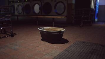 A trash can sitting on the ground in a room video