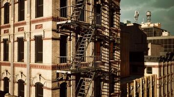 A tall building with a fire escape next to it video