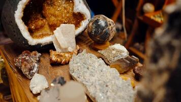 Opened tin and various unprocessed minerals lying on a table, a rock store. video