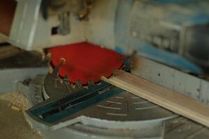 carpenter measuring, cutting, sanding wooden in workshop photo