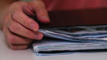 businessman hand working with a document folder in concept of document management system photo