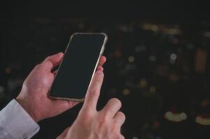 Social media marketing concept. businessman hand using smartphone typing, chatting conversation in chat box icons pop up blurred bokeh background photo