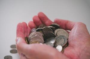 handful holding coins for saving investment and finance concept photo