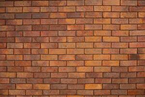 Red Textured Brick Wall Background with Old Cement Blocks and Brown Stone Pattern in Exterior Construction Architecture photo