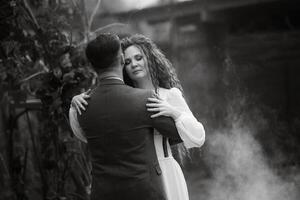 the first wedding dance of the bride and groom in the glade photo